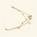 Gold-tone layered double chain necklace with mother-of-pearl butterfly pendant