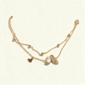 Gold-tone double layer necklace with mother-of-pearl and gold butterfly charms