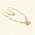 Gold-tone beaded chain necklace with rose pink square stone pendant