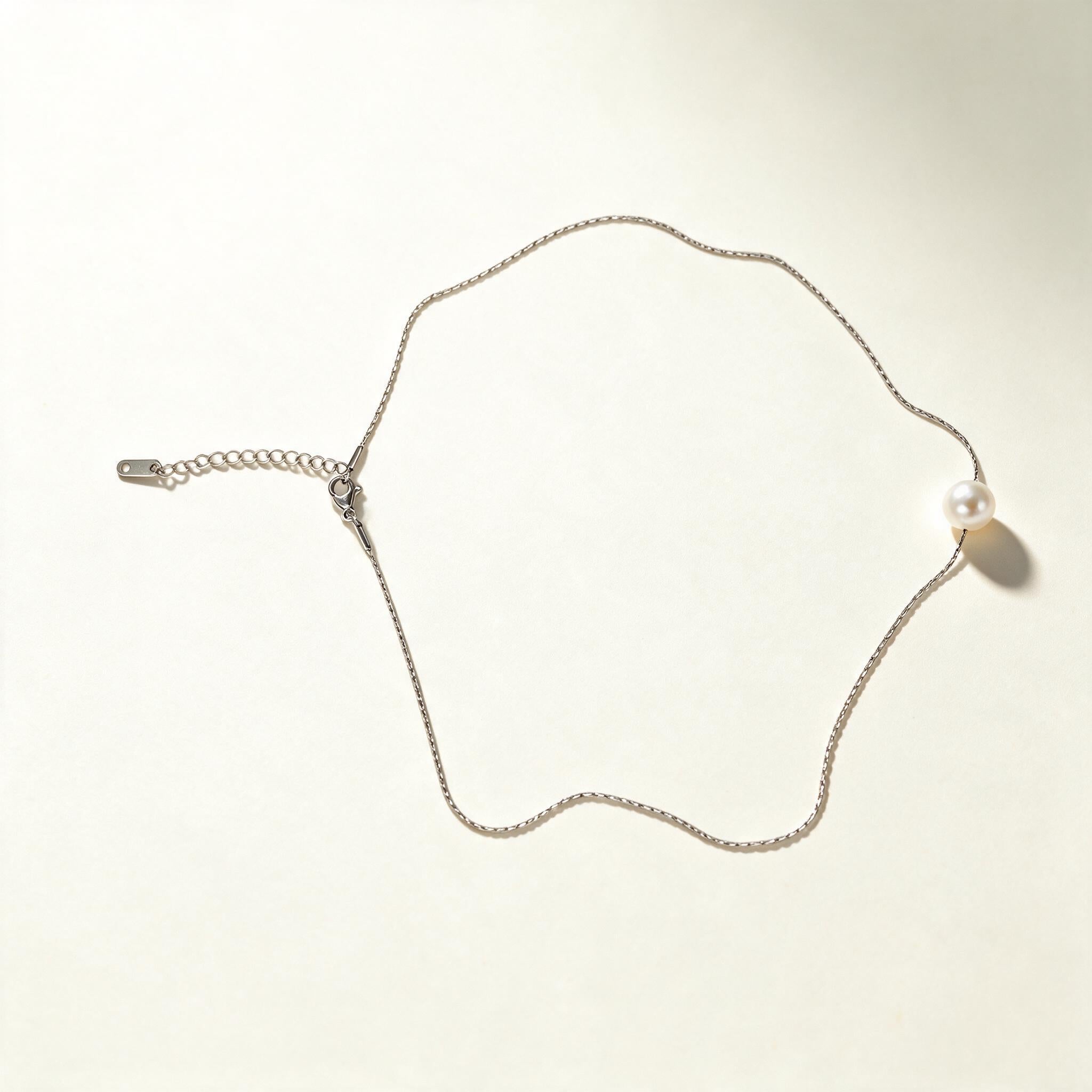 Silver-tone extra fine chain necklace with a single white pearl