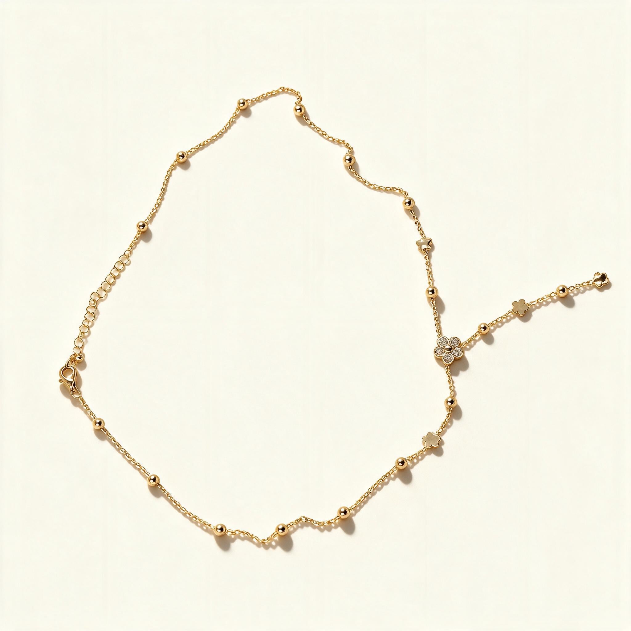 Gold-tone satellite chain necklace with four leaf clover charms