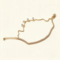Gold-tone cubic zirconia tennis chain necklace with hanging crystal drops