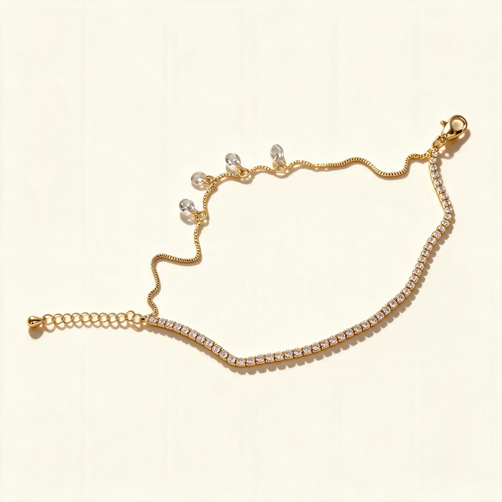 Gold-tone cubic zirconia tennis chain necklace with hanging crystal drops