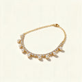 Gold-tone crystal tennis necklace with a fringe of small white shell pearls hanging below