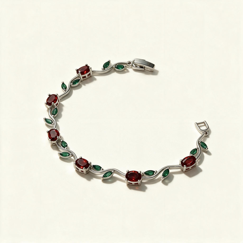 Silver-tone tennis bracelet with red ruby stones and green marquise leaf accents