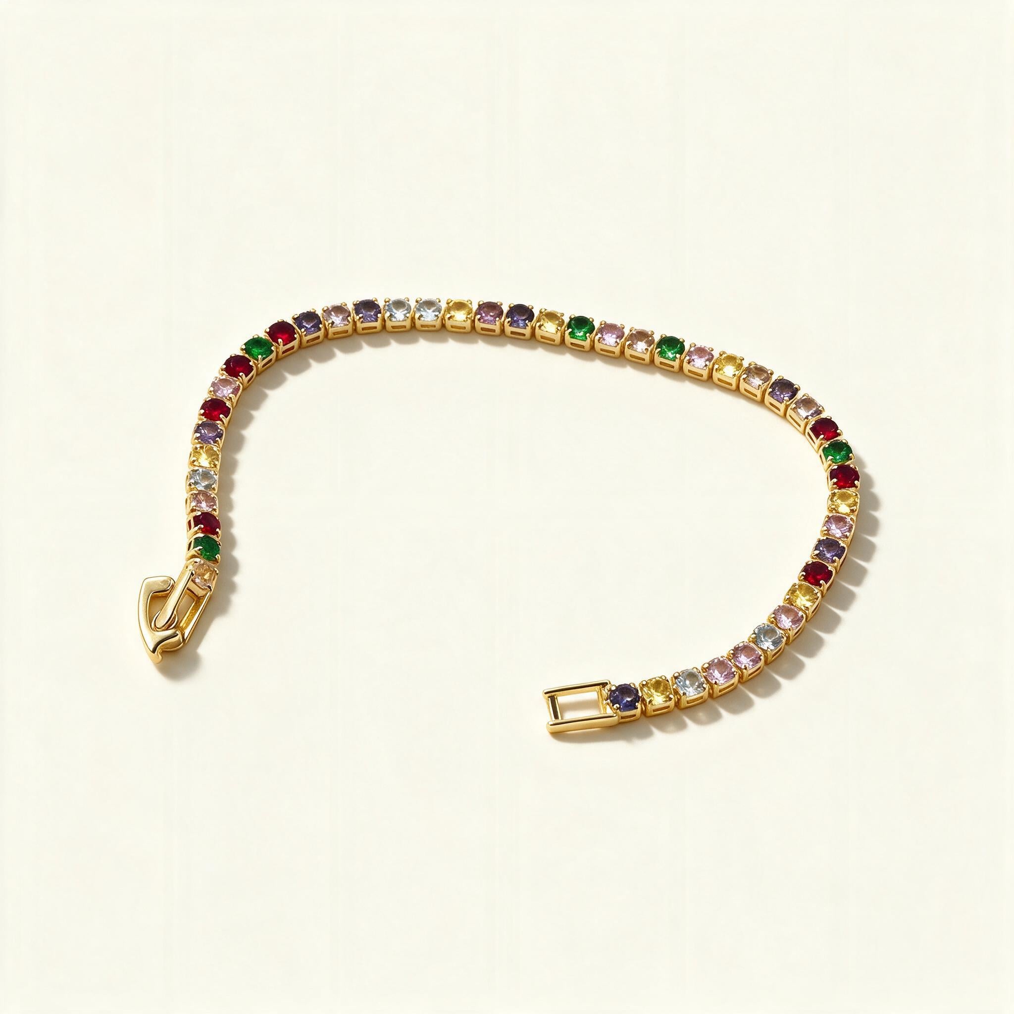 Gold-tone tennis bracelet set with rainbow coloured cubic zirconia stones
