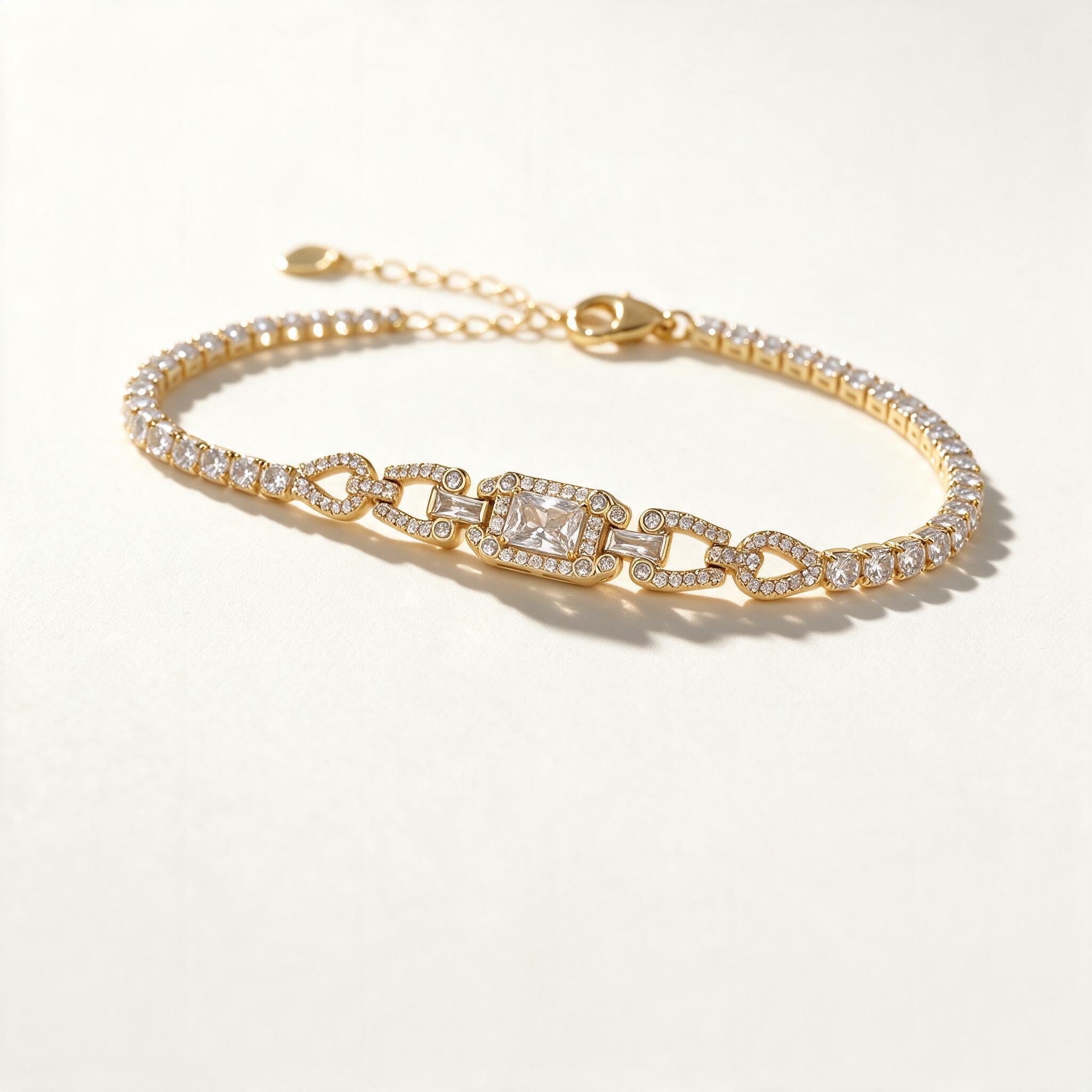 Gold-tone cubic zirconia tennis bracelet with art deco centre panel