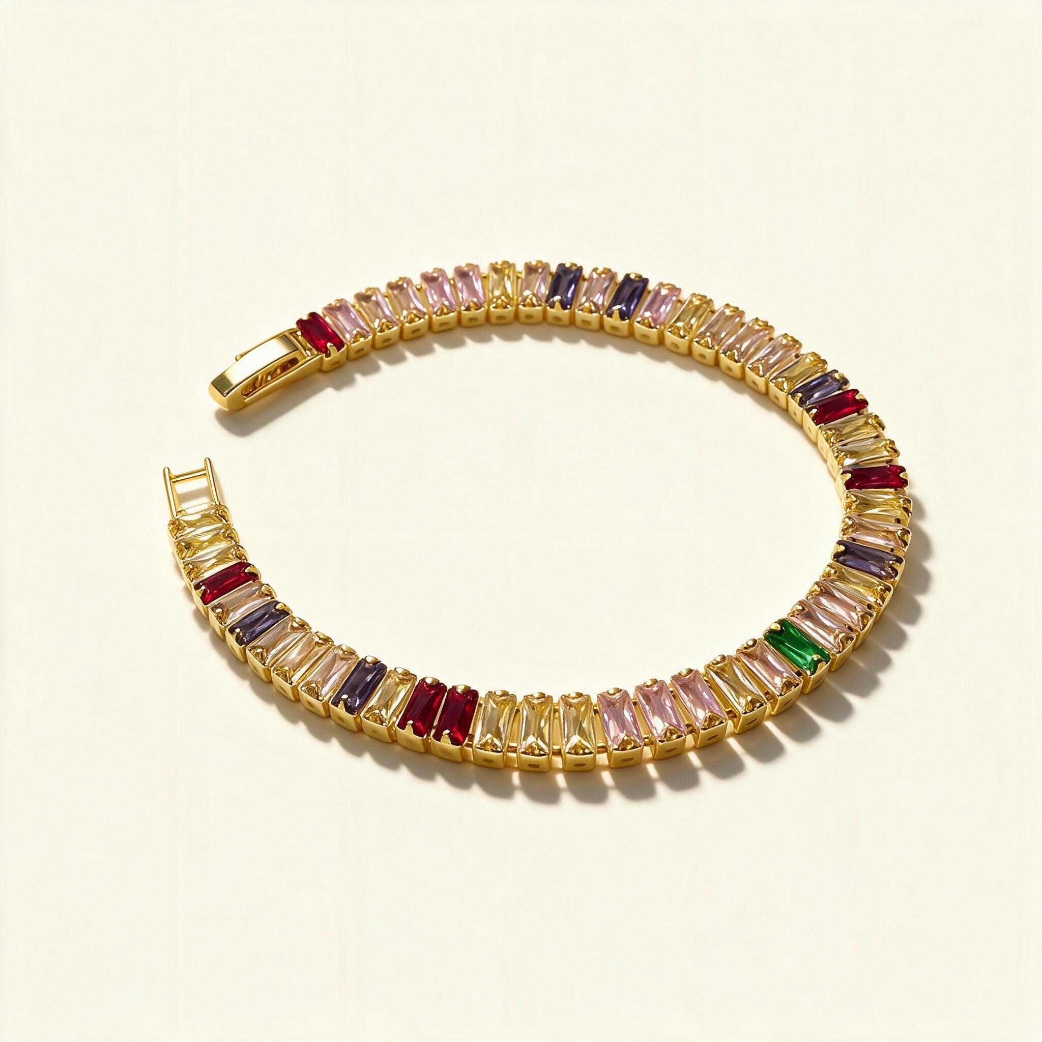 Gold-tone tennis bracelet with multicoloured baguette-cut stones