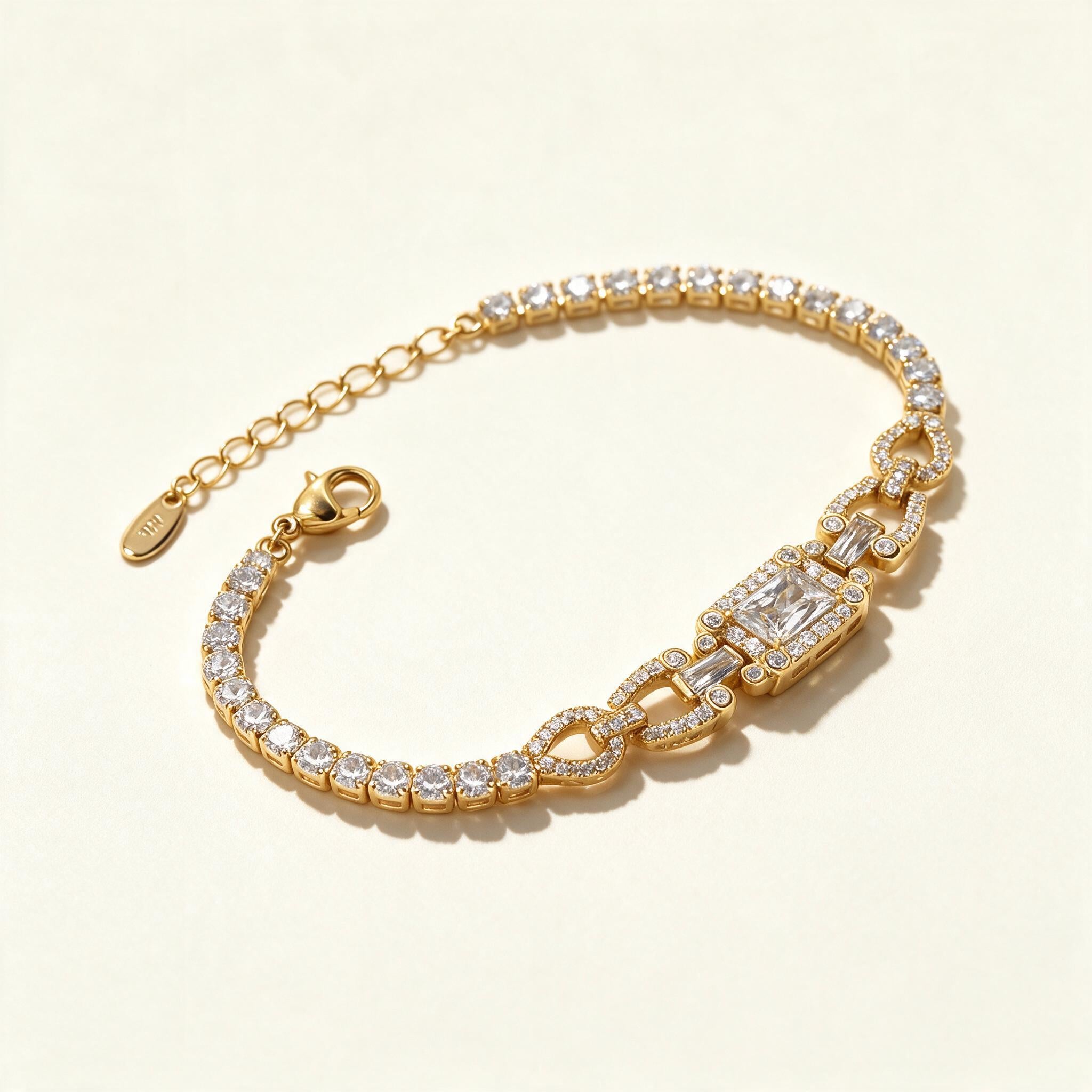 Gold-tone cubic zirconia tennis bracelet with pavé link and deco centre panel