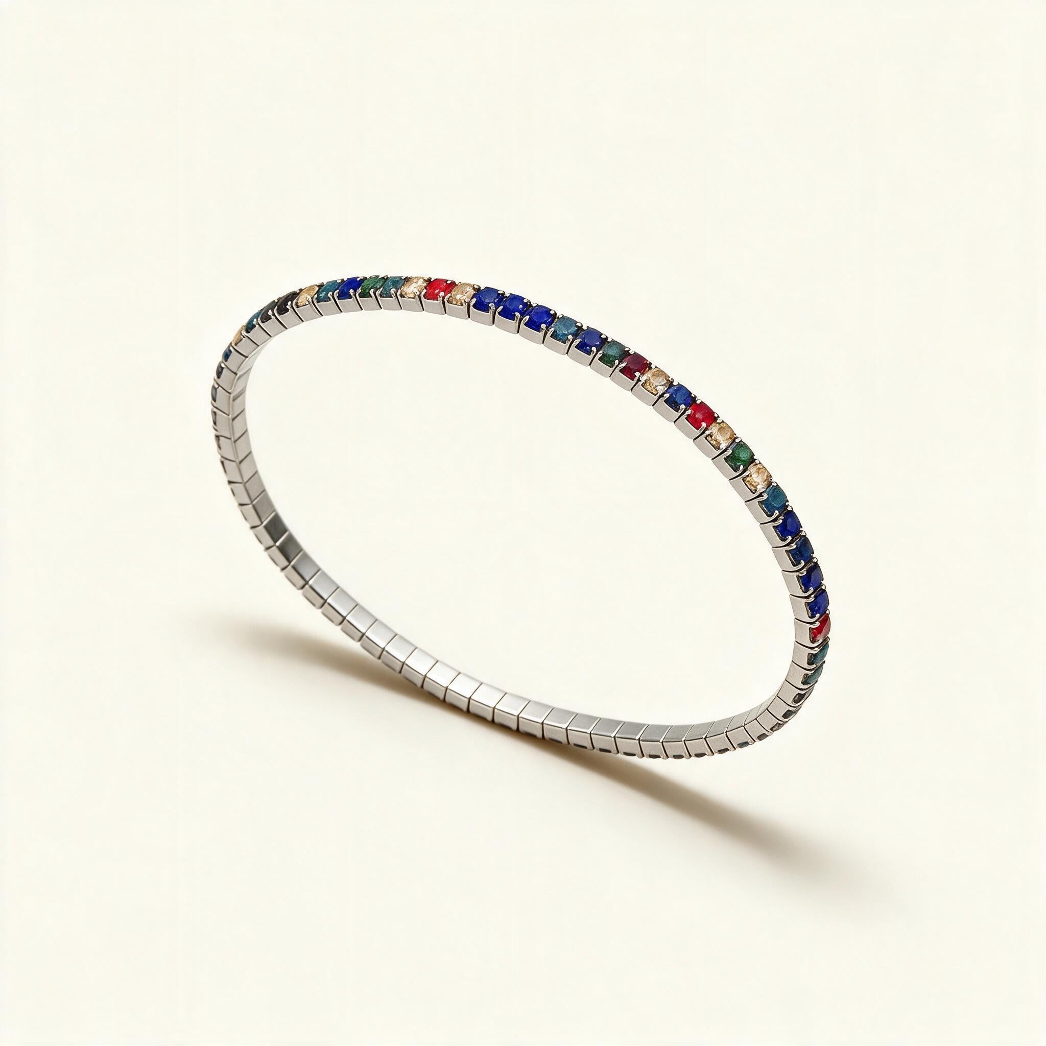 Silver-tone thin stretch tennis bracelet set with blue, red, green and champagne crystals