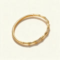 Gold-tone bamboo segment bangle with pavé cubic zirconia sections