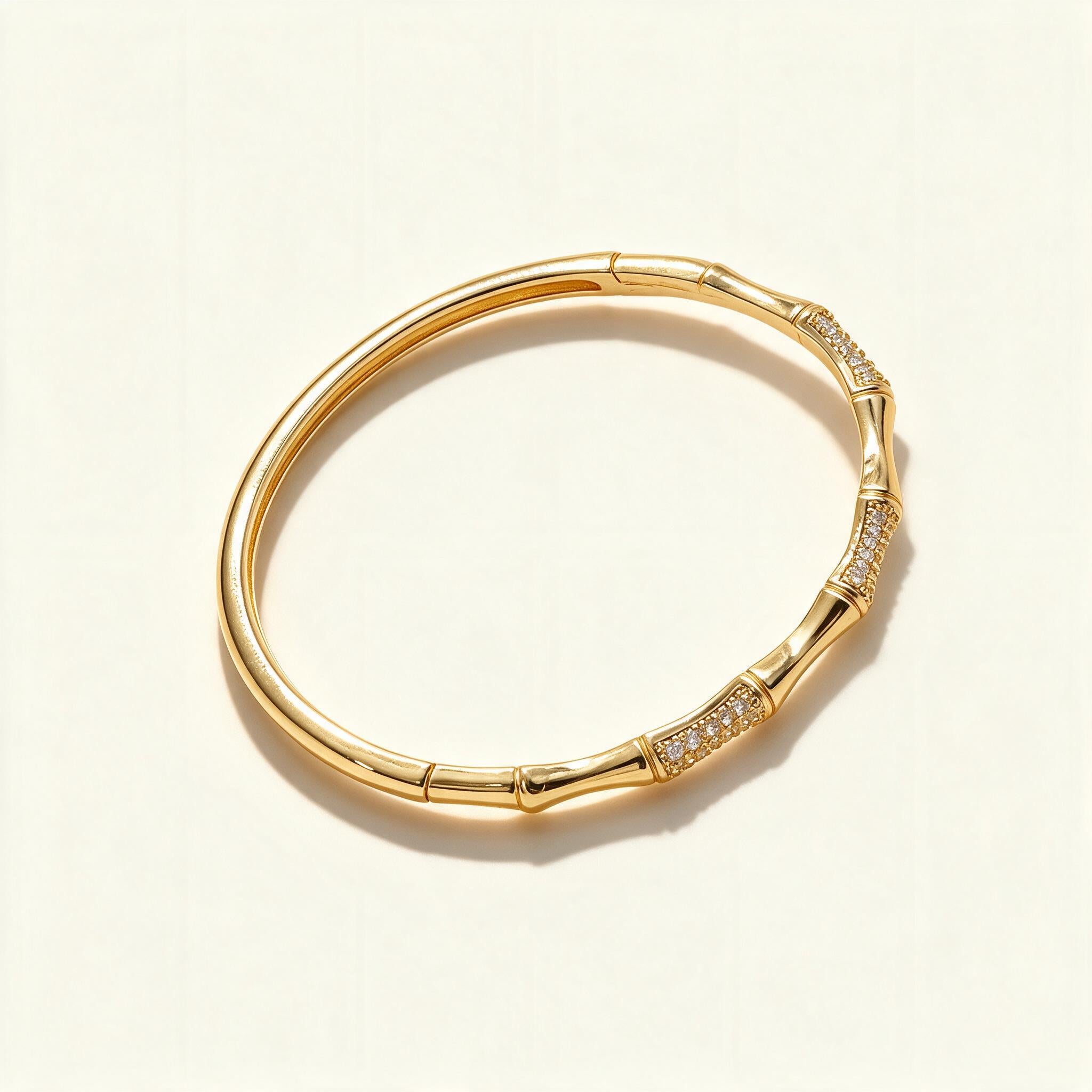 Gold-tone bamboo segment bangle with pavé cubic zirconia sections
