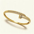 Gold-tone quilted bangle with crossover pavé cubic zirconia line