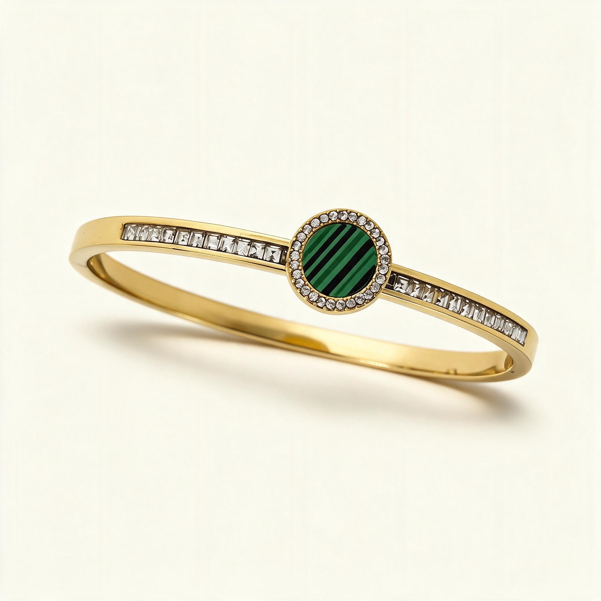 Gold-tone bangle with green malachite disc in crystal halo and baguette channel band