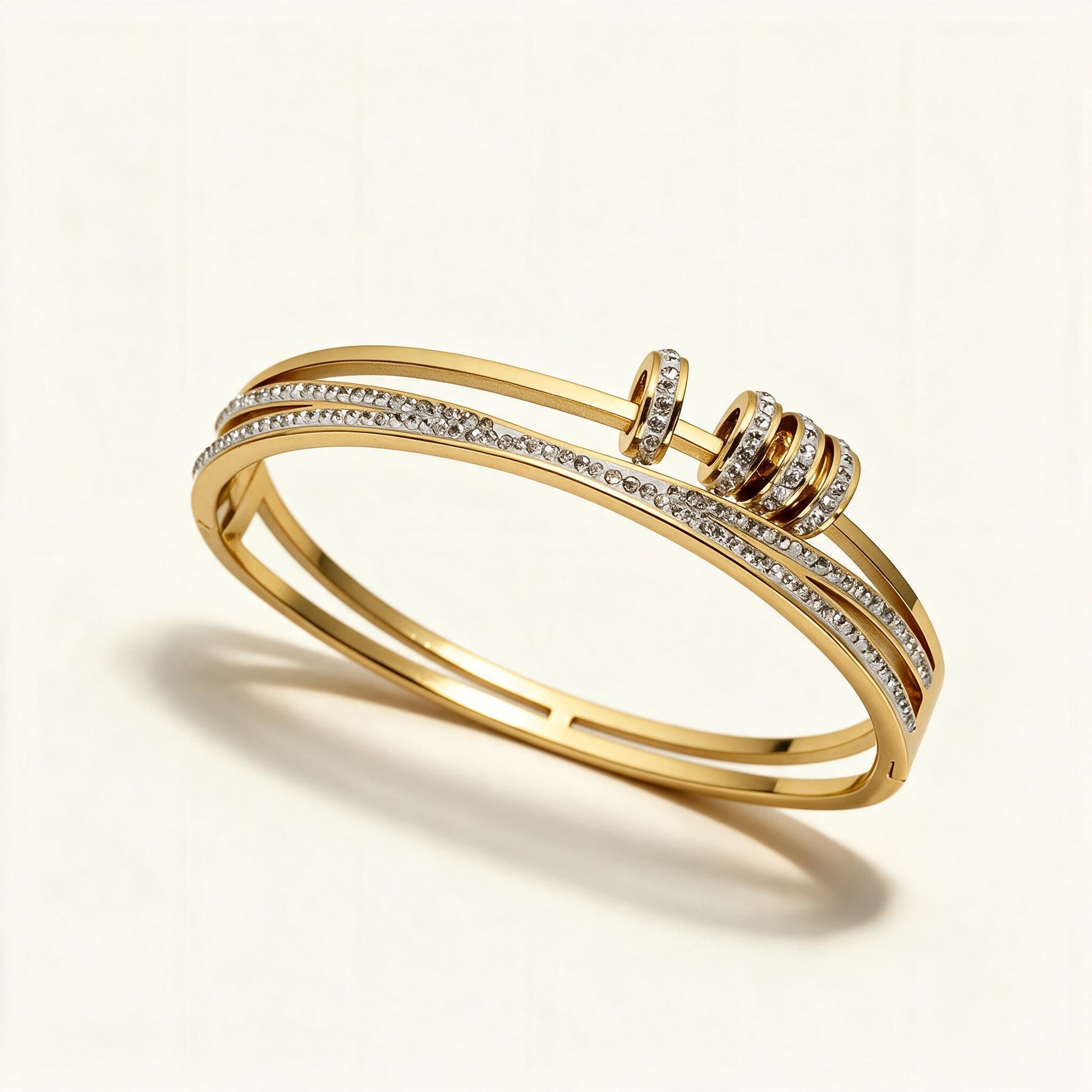 Gold-tone double band bangle with pavé crystals and wrapped crystal rings
