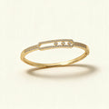 Gold-tone pave bangle with an open frame holding three floating clear crystals