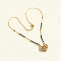 Gold-tone short mangalsutra with black beads and cubic zirconia heart pendant
