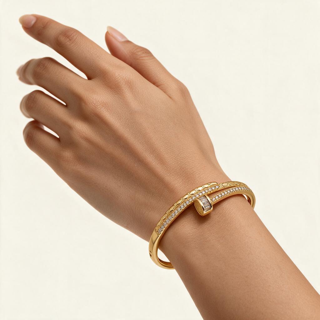 Woman wearing the Everly gold tone quilted pave wrap bangle on her wrist