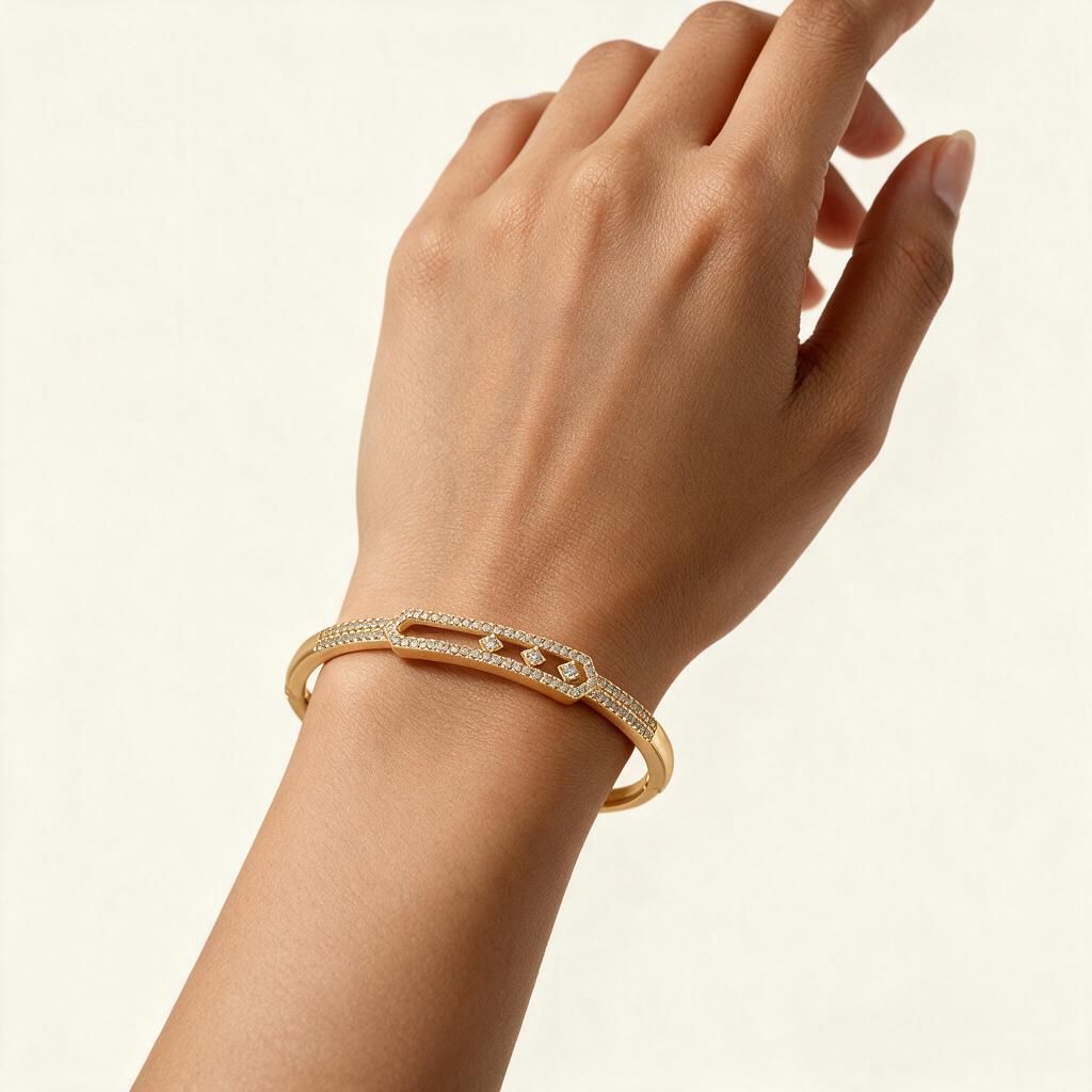 Woman wearing the Bexley gold tone pave bangle with three floating crystals on her wrist