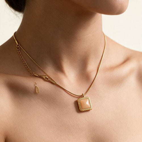 Woman wearing the necklace at the collarbone
