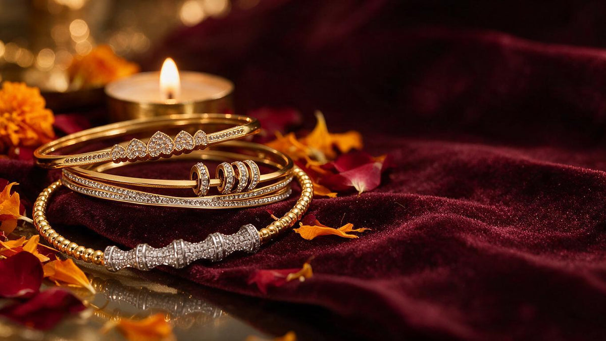 Gold and silver tone pave bangles stacked on dark maroon velvet with marigold petals and a lit brass tealight