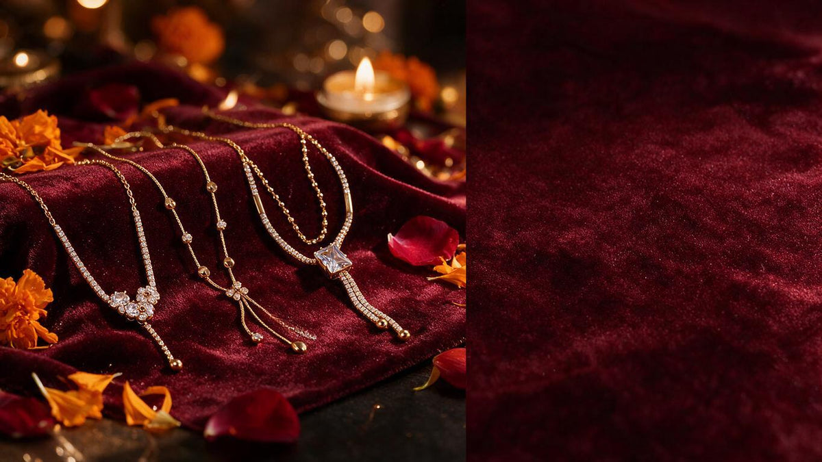 Layered crystal and pearl chains on dark maroon velvet with marigold petals and a tealight